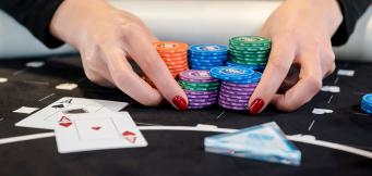 poker player going all-in with aces